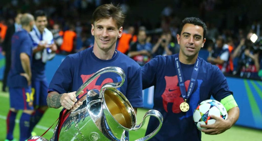 Leo Messi y Xavi Hernández celebran la Champions lograda en Berlín en 2015.