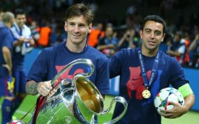 Leo Messi y Xavi Hernández celebran la Champions lograda en Berlín en 2015.