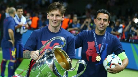 Leo Messi y Xavi Hernández celebran la Champions lograda en Berlín en 2015.