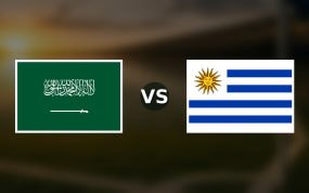 Banderas de Arabia Saudí y Uruguay enfrentadas sobre un campo de fútbol difuminado, pronóstico del Mundial 2026