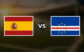 Banderas de España y Cabo Verde enfrentadas sobre un campo de fútbol difuminado, pronóstico del Mundial 2026
