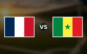 Banderas de Francia y Senegal enfrentadas sobre un campo de fútbol difuminado, pronóstico del Mundial 2026