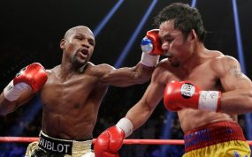 Floyd Mayweather Jr. conecta un golpe a Manny Pacquiao durante su combate en Las Vegas